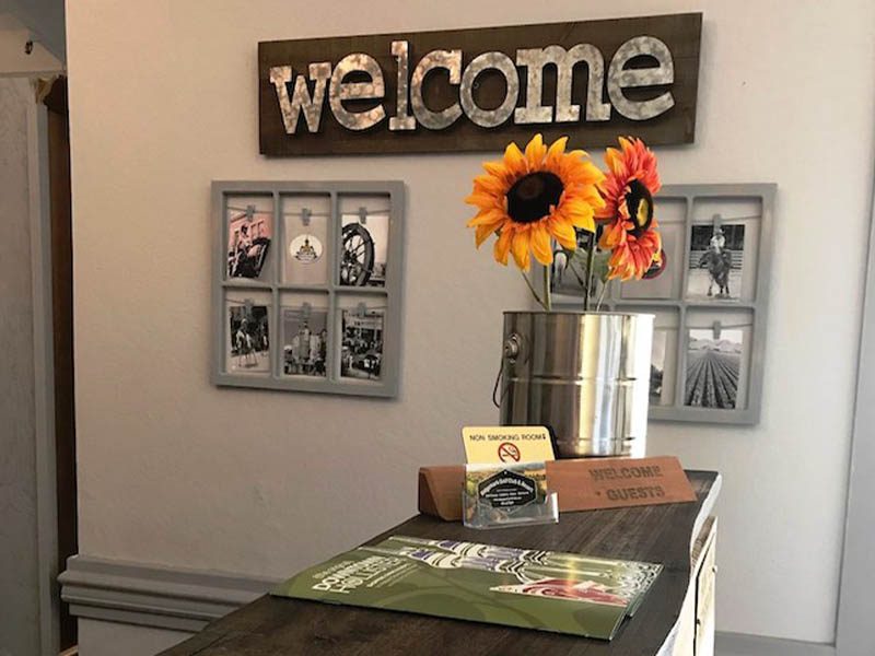 Welcome display with flowers, local photos, and guest information at The Lodge at Ridgemark Golf Club & Resort.
