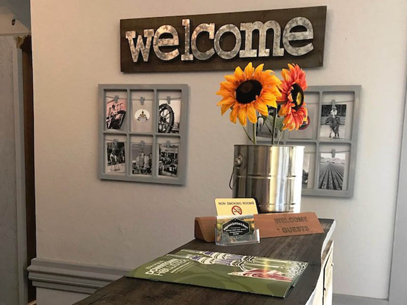 Welcome display with flowers, local photos, and guest information at The Lodge at Ridgemark Golf Club & Resort.